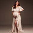 Pregnant woman in off-shoulder chiffon ruffle sleeve maternity dress, showcasing elegant summer style in photography studio.