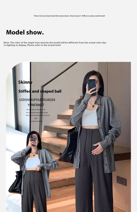 Model showcasing wide-leg maternity pants and a stylish top, standing indoors with a bag.