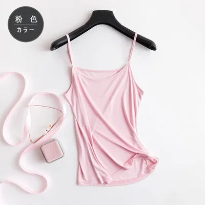 Soft pink silk blend knit camisole hanging on a hanger, perfect for summer lingerie.