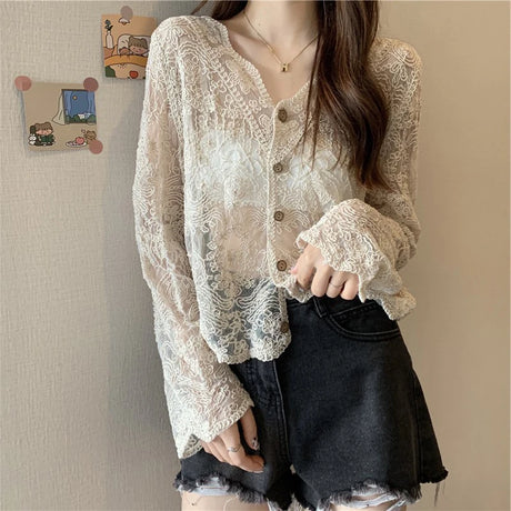 SheerCharm™ lace sun shirt in beige, featuring long sleeves and a loose fit, styled with shorts.