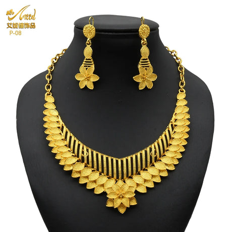 Luxury Indian bridal jewelry set featuring a 24K gold plated necklace and matching earrings. Ideal for weddings.