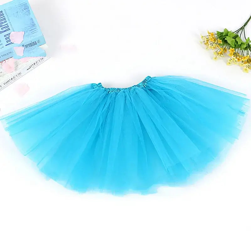 Blue tulle skirt for girls, perfect for parties and dress-up, made with soft materials for comfort and style.