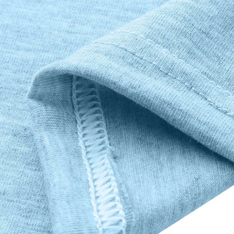 Close-up of a light blue cotton fabric emphasizing the stitch quality and softness suitable for casual wear.