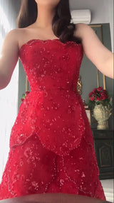 Customized pink beaded engagement dress with tiered skirt and sequined details.