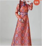 Traditional Mongolian women's dress in vibrant orange with intricate patterns and full sleeves.