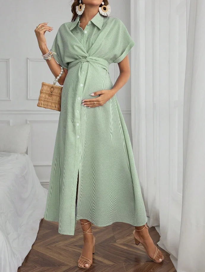 Casual striped short sleeve maternity dress in green, featuring a tie waist and mid-calf length, perfect for summer wear.