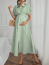Casual striped short sleeve maternity dress in green, featuring a tie waist and mid-calf length, perfect for summer wear.