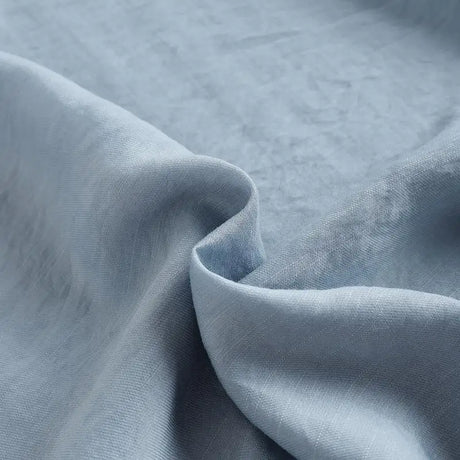 Close-up of soft blue fabric showcasing a luxurious texture for clothing.