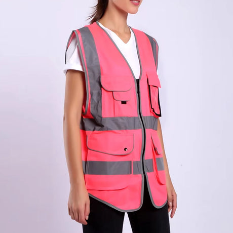 Hi-Vis pink safety vest with multiple pockets and reflective stripes, designed for construction and outdoor work.