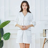 Custom logo white short sleeve beauty uniform tunic with pockets for women in salon or medical settings.