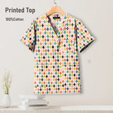 Colorful printed hospital scrub top made of 100% cotton, featuring a V-neck design and pockets for nurses.