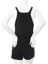 Back view of a sleeveless ribbed maternity jumpsuit in black, designed for casual comfort during summer.