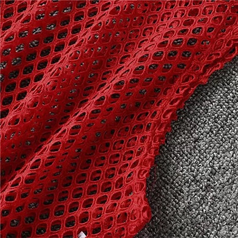 Close-up of red mesh fabric showcasing hollow-out design, ideal for breathable summer crop top style.
