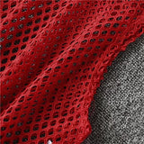 Close-up of red mesh fabric showcasing hollow-out design, ideal for breathable summer crop top style.