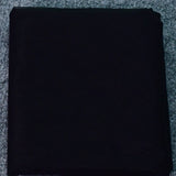 Black fabric roll, ideal for various sewing projects and garment making.