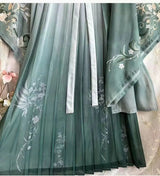Elegant Song Dynasty Hanfu set featuring chiffon fabric with intricate floral printing in soft green hues.