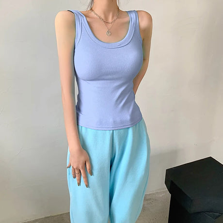 Light blue sleeveless ribbed tank top paired with light blue pants, showcasing 90s vintage streetwear style.