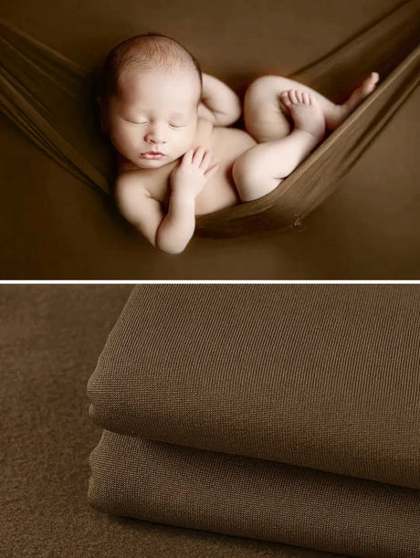 Newborn wrapped in a soft brown blanket, ideal for photography, showcasing comfort and style in 55 colors.