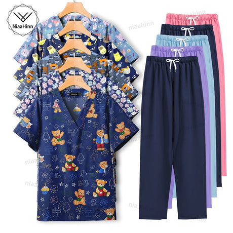 Cartoon print dental scrubs for women, featuring playful designs and matching pants, ideal for pet grooming workwear.