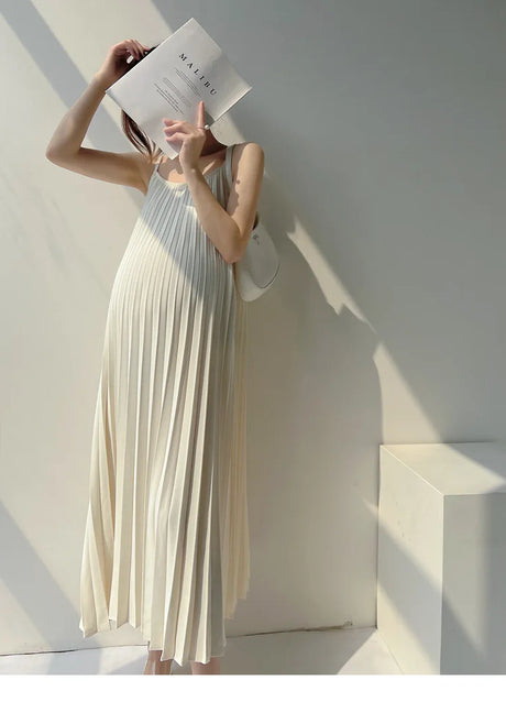 Pleated chiffon maternity dress in natural color with mid-calf length, ideal for summer wear.