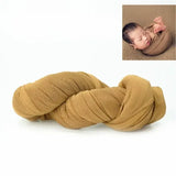 Solid mustard-colored blanket for baby photoshoot, ideal for newborn photography and cozy settings.