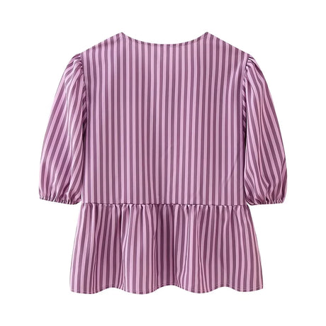 Back view of BowChic™ Stripe Lace-Up Blouse in purple stripes, featuring short puff sleeves and peplum hem.