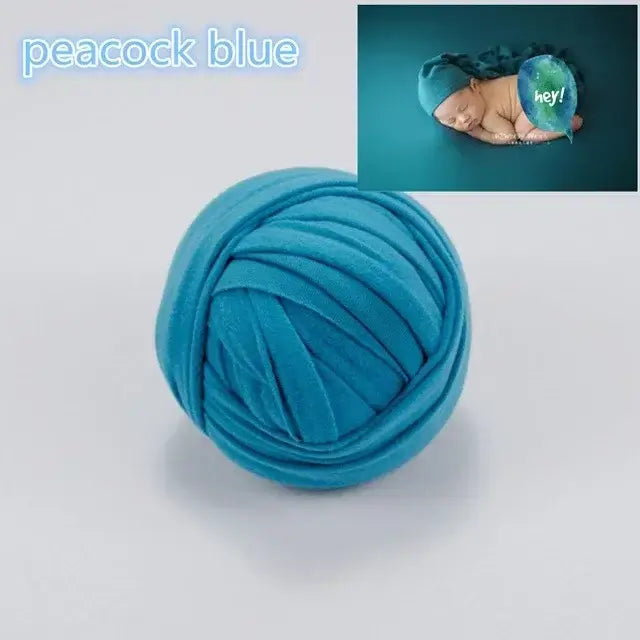 Peacock blue newborn photography blanket for baby photoshoots, ideal for ages 0-1 year.