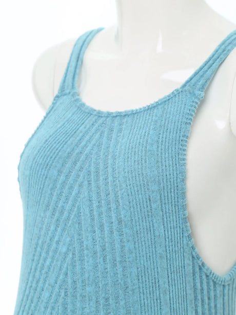 Close-up of sleeveless ribbed maternity jumpsuit in light blue, showcasing the soft texture and loose fit.