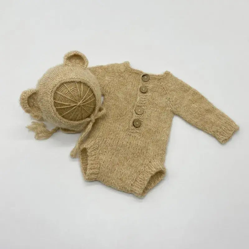 Newborn photo romper and bear bonnet set in beige with buttons, ideal for unisex baby photography props.