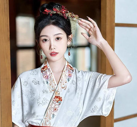 Elegant woman wearing a Traditional Hanfu oversized embroidered blouse with floral designs, showcasing cultural beauty.