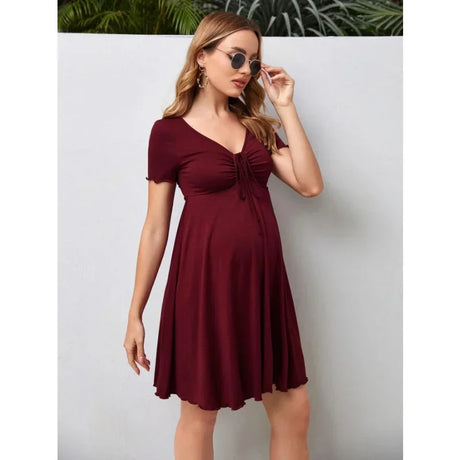 Pure Color V-Neck Maternity Dress in burgundy, knee-length, perfect for summer, featuring short sleeves and A-line silhouette.