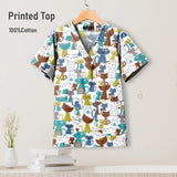 Pediatric hospital surgical scrub top featuring colorful cat print, made from breathable 100% cotton.
