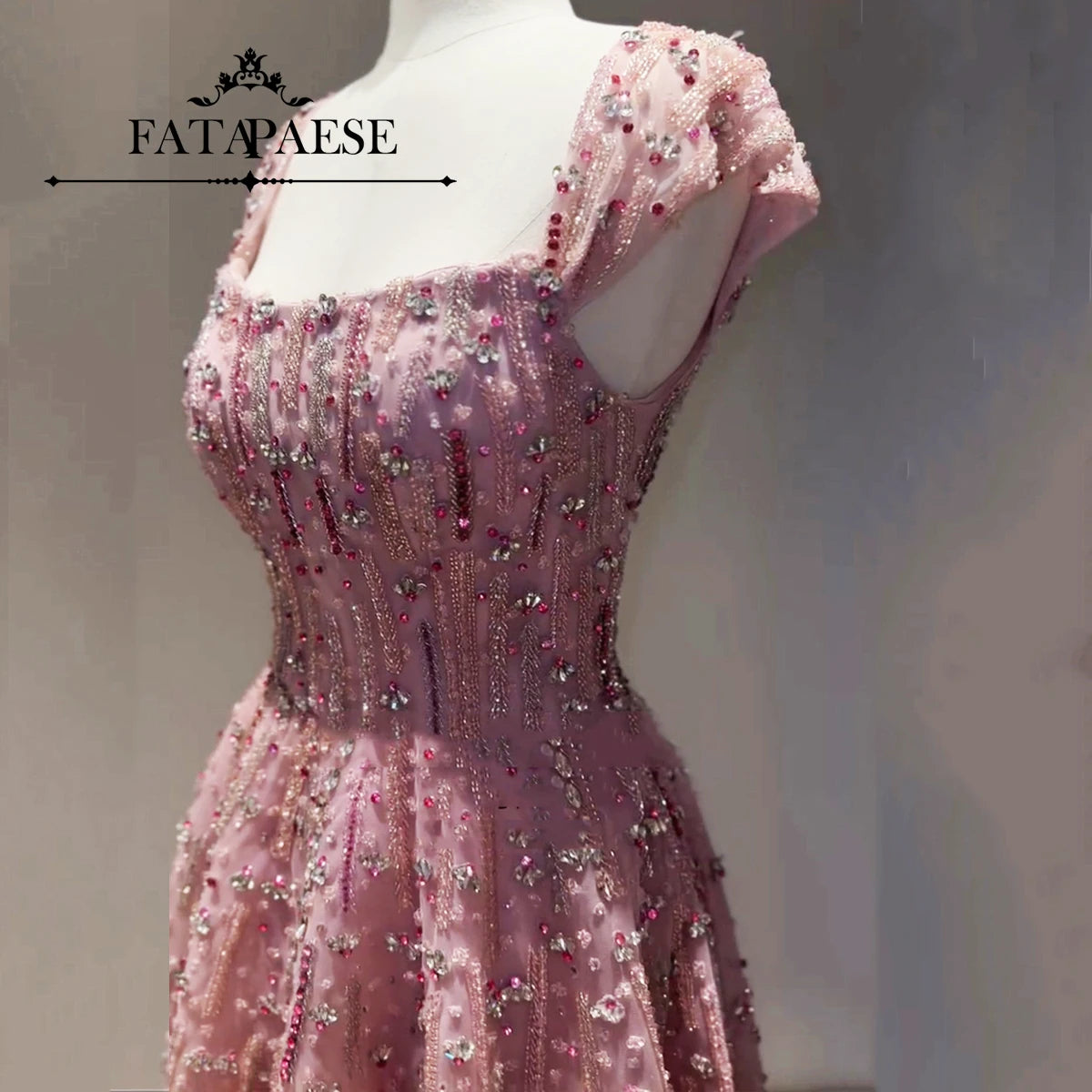 Glitter crystal mermaid wedding gown by FATAPAESE, featuring exquisite beading and a elegant square neckline.