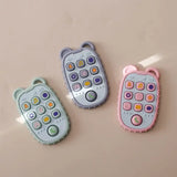Colorful silicone baby toy phones in green, purple, and pink, designed for toddlers, featuring interactive buttons.