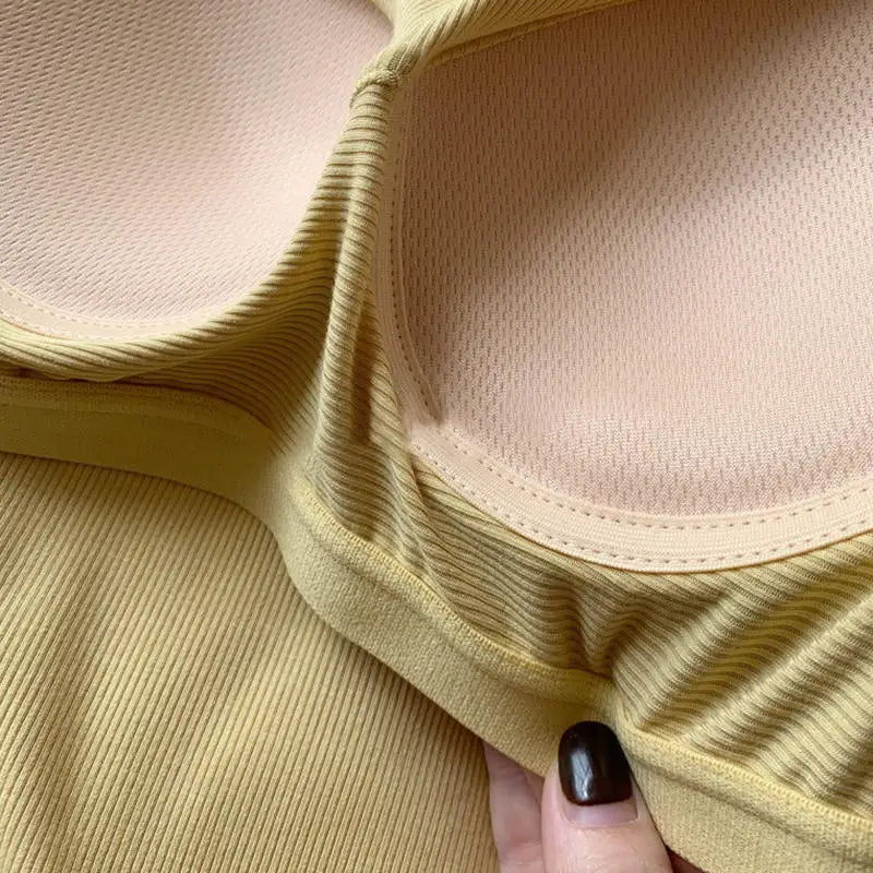 Close-up of SlimCotz™ padded cotton spaghetti camis detailing, showcasing breathable material and ribbed fabric.