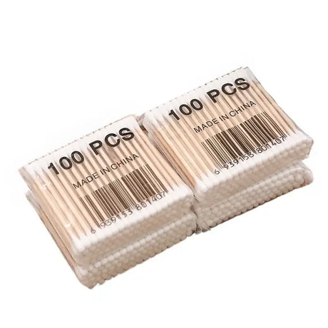 Pack of 100 baby cotton swabs with wooden sticks, made in China, ideal for cleaning and care for babies.