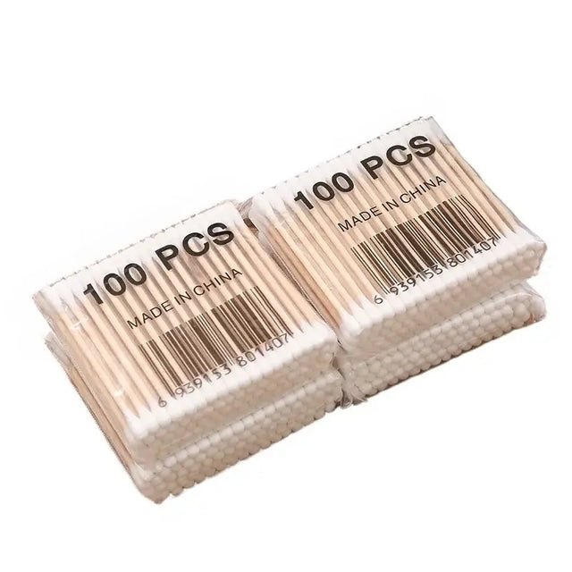 Pack of 100 baby cotton swabs with wooden sticks, made in China, ideal for cleaning and care for babies.