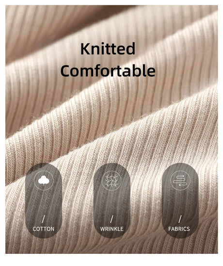 Close-up of soft knitted cotton fabric with comfort indicators for wrinkle resistance and quality.