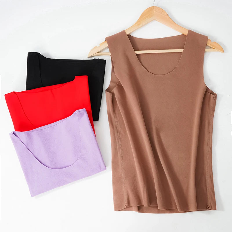 HeatHold™ Thermal Slim Inner Vest in various colors: black, red, lavender, and brown on a hanger, winter undershirt for women.