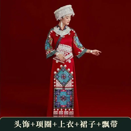 Miao embroidery suit worn by a woman, featuring vibrant colors and intricate patterns, perfect for festival celebrations.