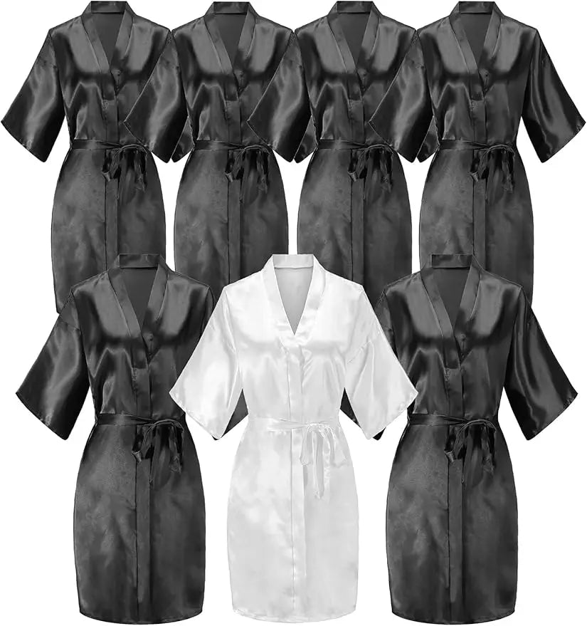 7-piece satin bride robe set featuring 6 black and 1 white kimono-style robes for bridal party.