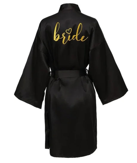 Black satin bride robe with gold lettering, perfect for wedding preparations and special occasions.