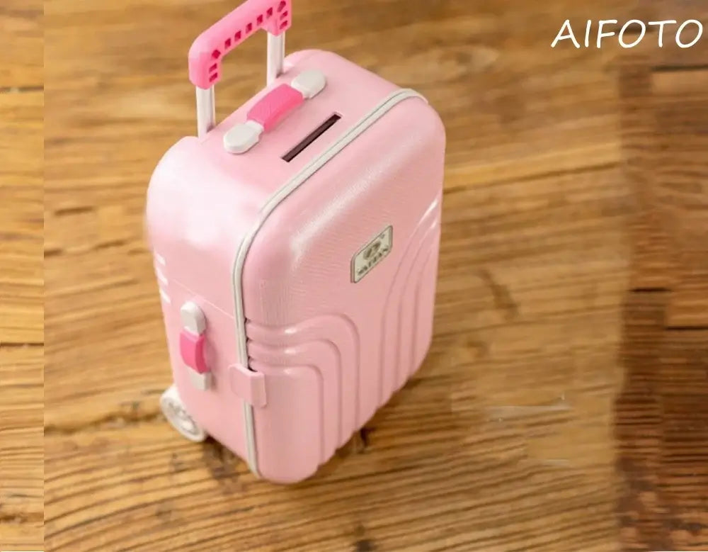 Pink mini suitcase with wheels and a handle, ideal for kids and travel, perfect for storing toys or baby essentials.