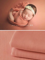 Newborn soft wrap blanket in peach color perfect for photography, featuring unisex design and high-quality fabric.