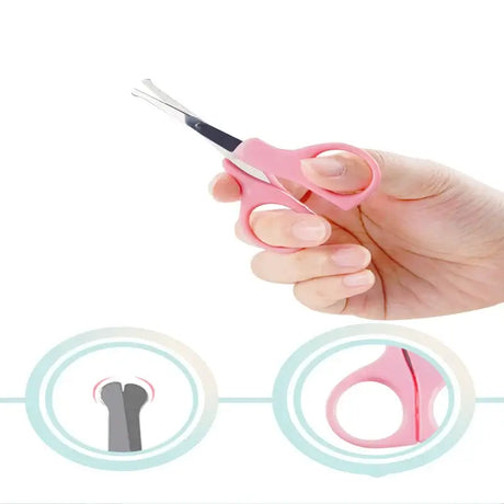 Hand holding a pink newborn baby nail scissor designed for safe trimming of delicate nails.