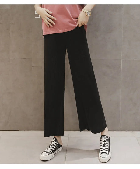 Breathable adjustable waist maternity wide leg pants in black, perfect for summer comfort and style.
