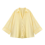 WideLine™ oversized yellow shirt with turn-down collar and button closure, perfect for summer casual wear.