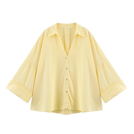 WideLine™ oversized yellow shirt with turn-down collar and button closure, perfect for summer casual wear.