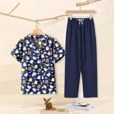 Cartoon print dental scrubs set featuring cute animal designs, breathable cotton fabric for women in navy and colorful tops.