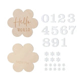 Wooden baby milestone flowers with engraved 'Hello World' and 'Month' text, and numeric and floral accent pieces.